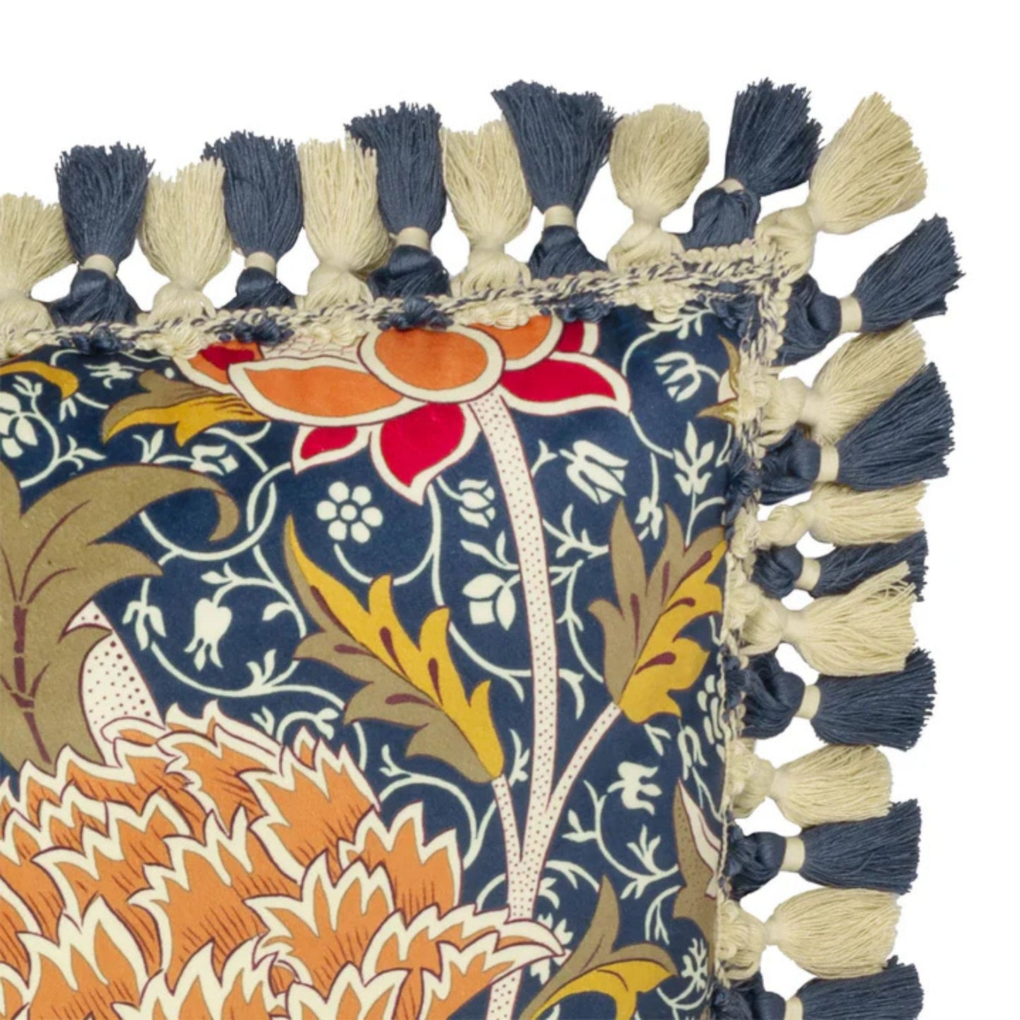 Cushion corner detail with navy and white fringe on a white background