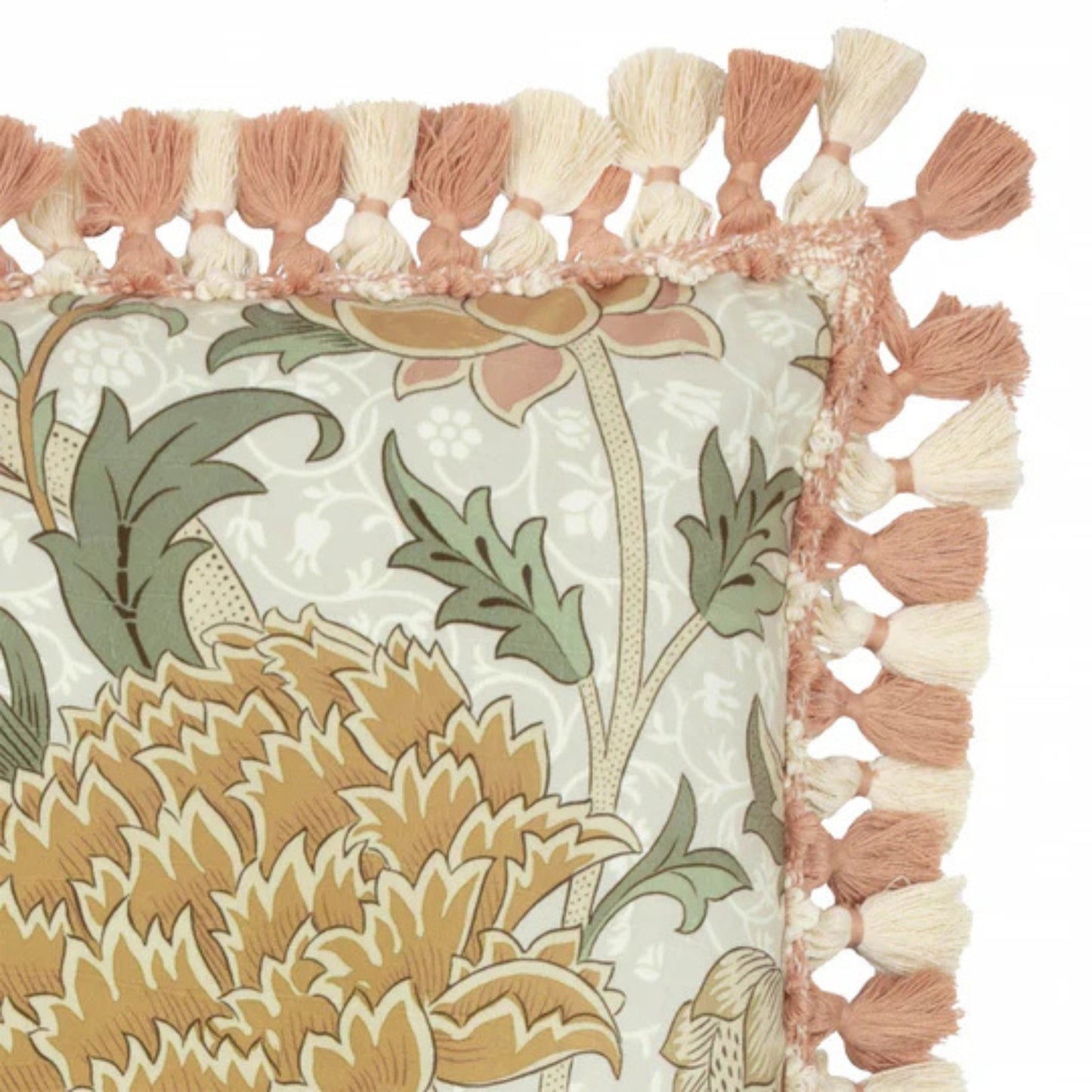Decorative pillow with floral pattern and tassel trim on a white background