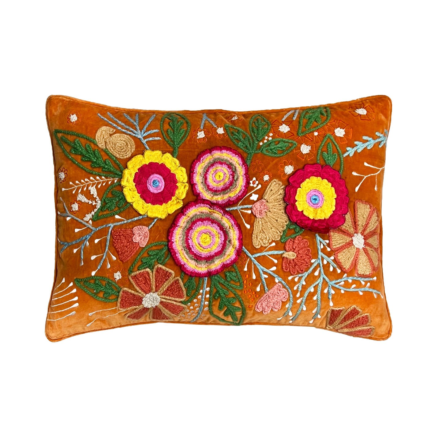 An ornately embroidered velvet cushion with a rich orange base and colourful floral patterns on it on a white background.
