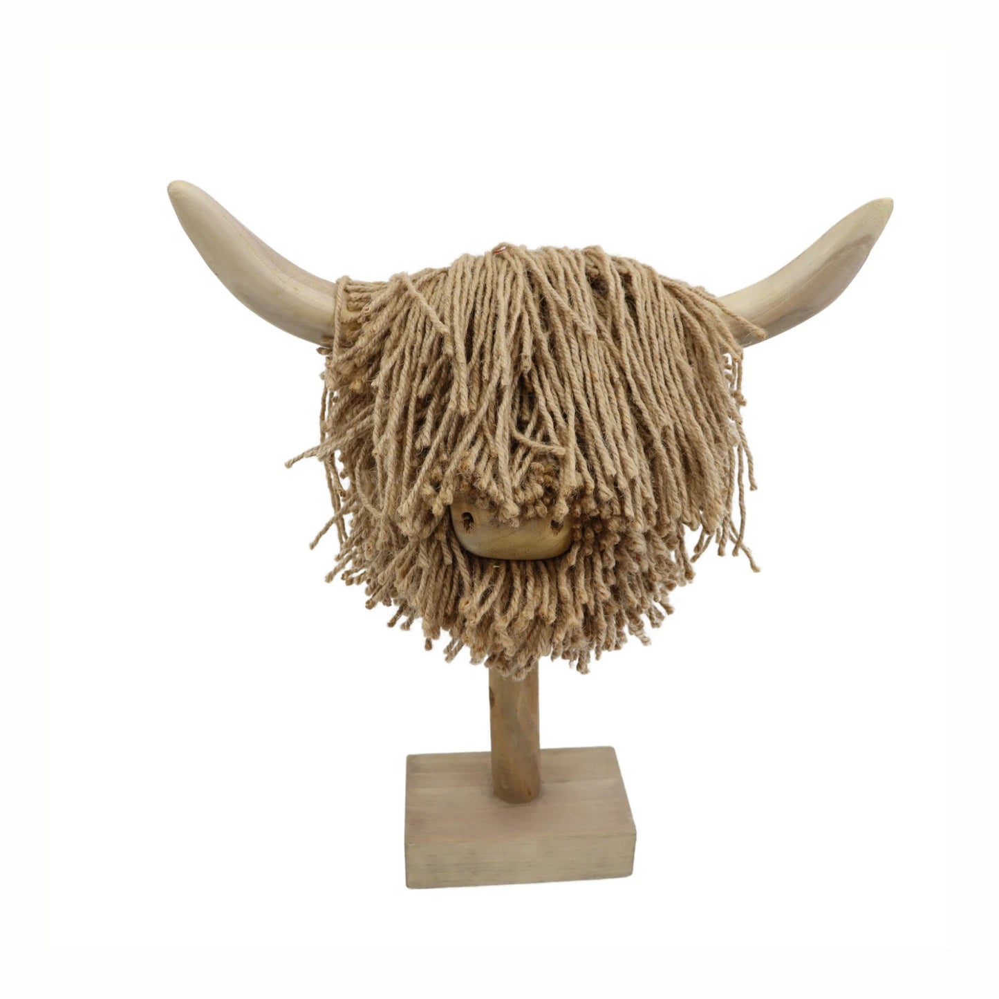 Decorative head of a highland cow with long jute hair on a stand against a white background