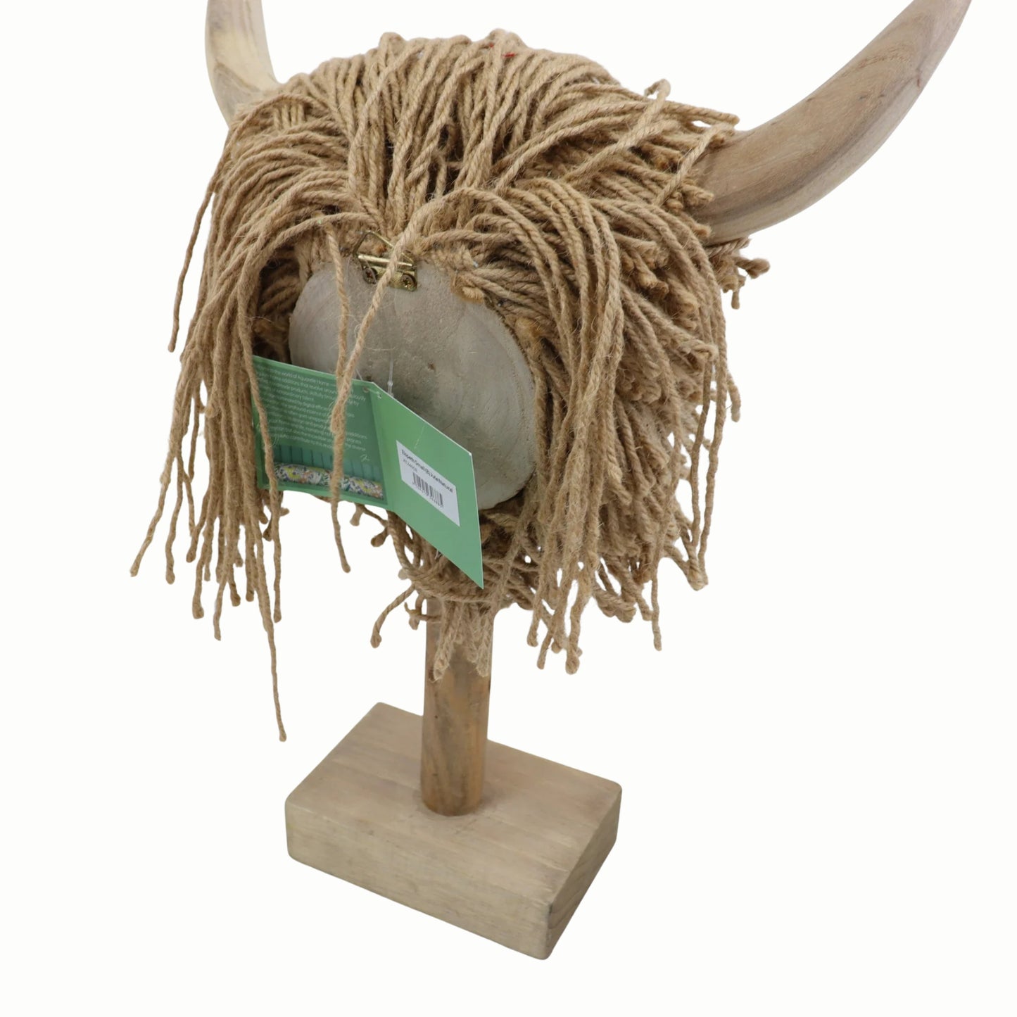 Decorative Highland cow head with jute hair and wooden base on a white background