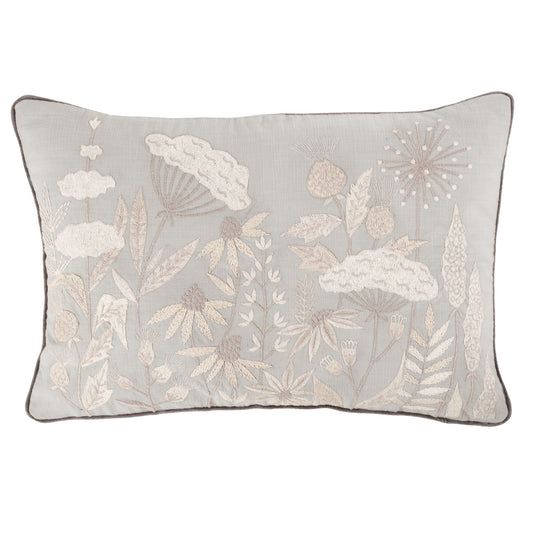 A rectangular Ezra Cloud cushion with a floral embroidered design in beige on a grey background, piped in deep grey velvet.