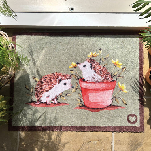 Hug Rug washable door mat with hedgehog design at doorway entrance