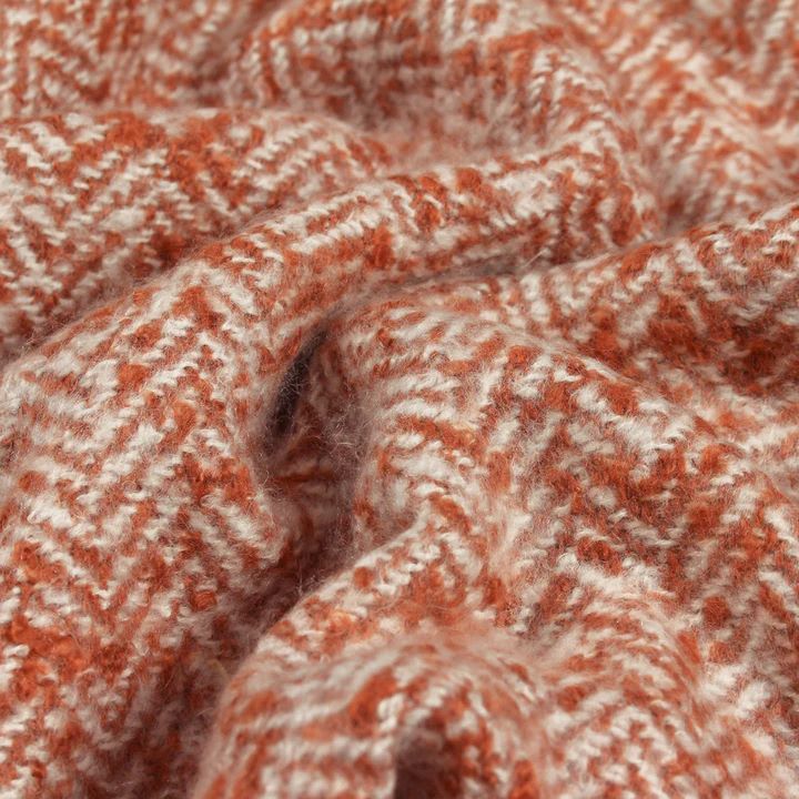 Close up of wool blend rust throw