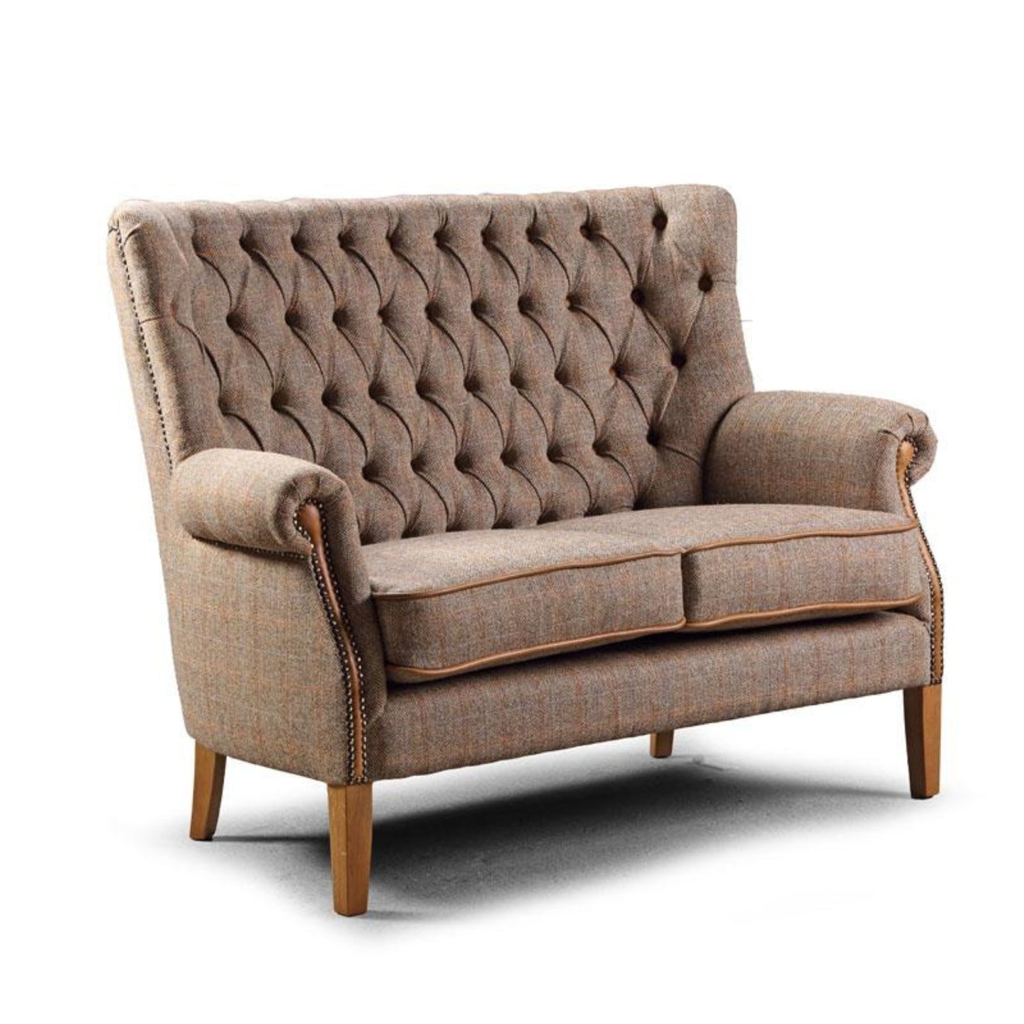 Brown tweed button high back sofa on a white background
