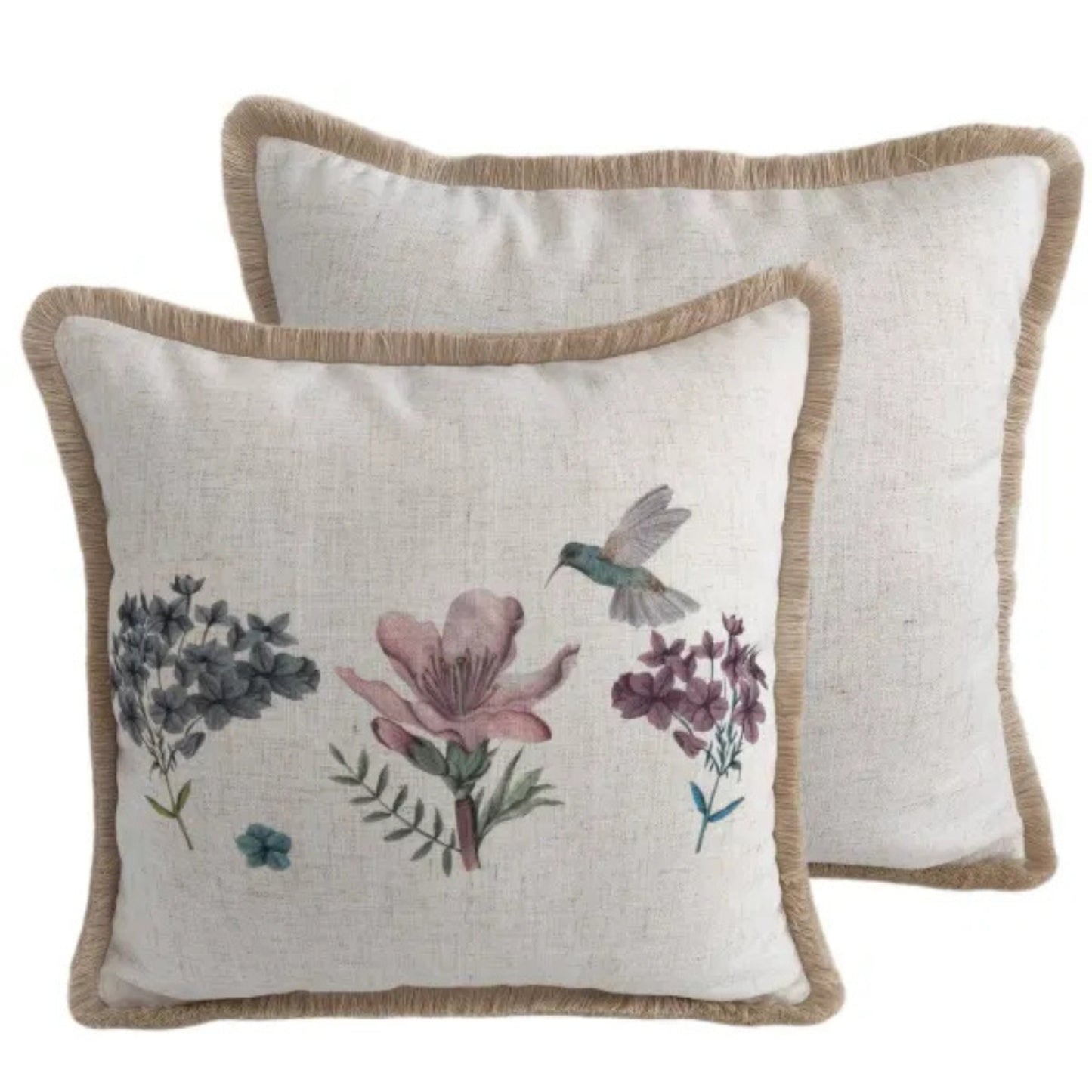 Two decorative pillows with floral and hummingbird designs on a white background