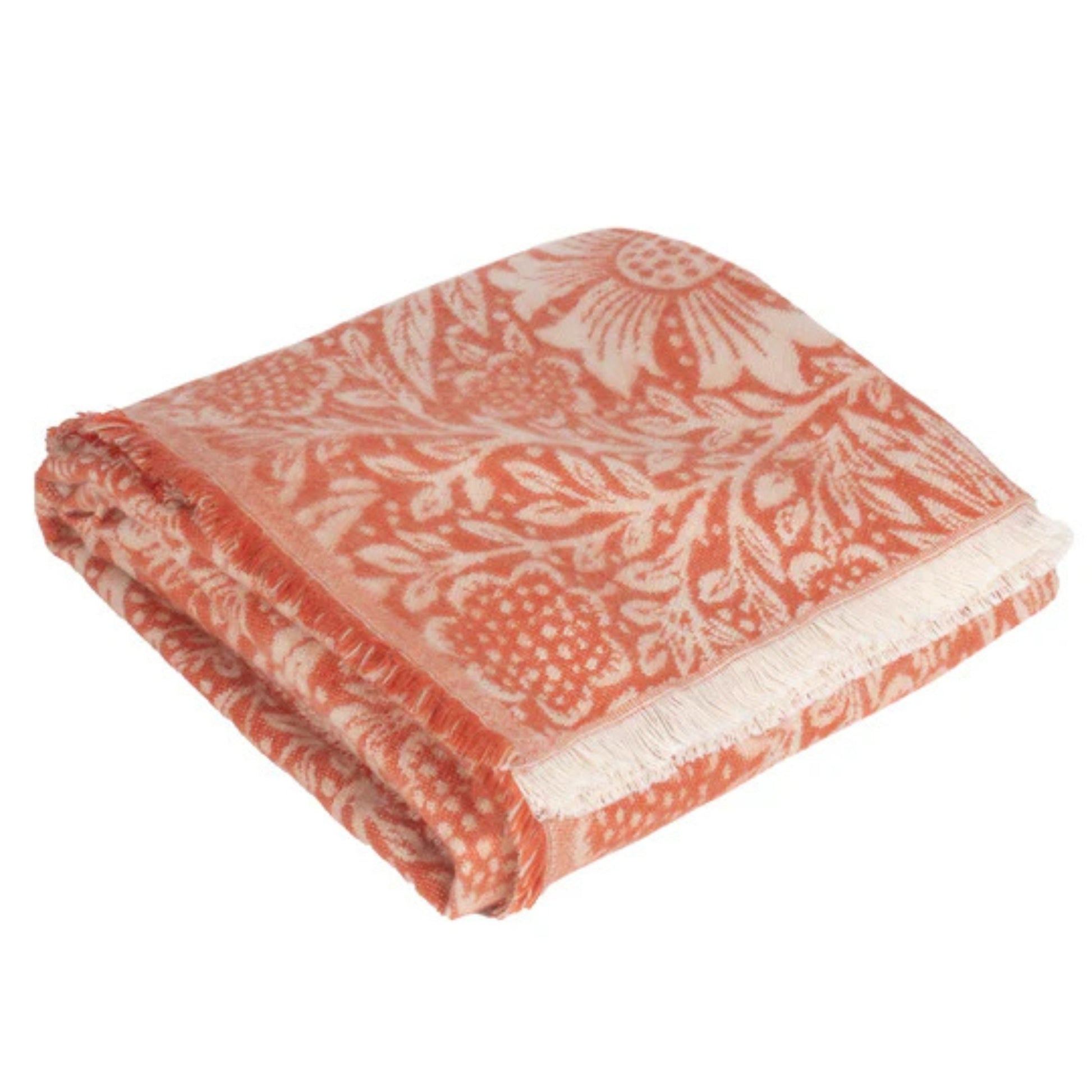 Floral patterned blanket with coral and white colors on a white background