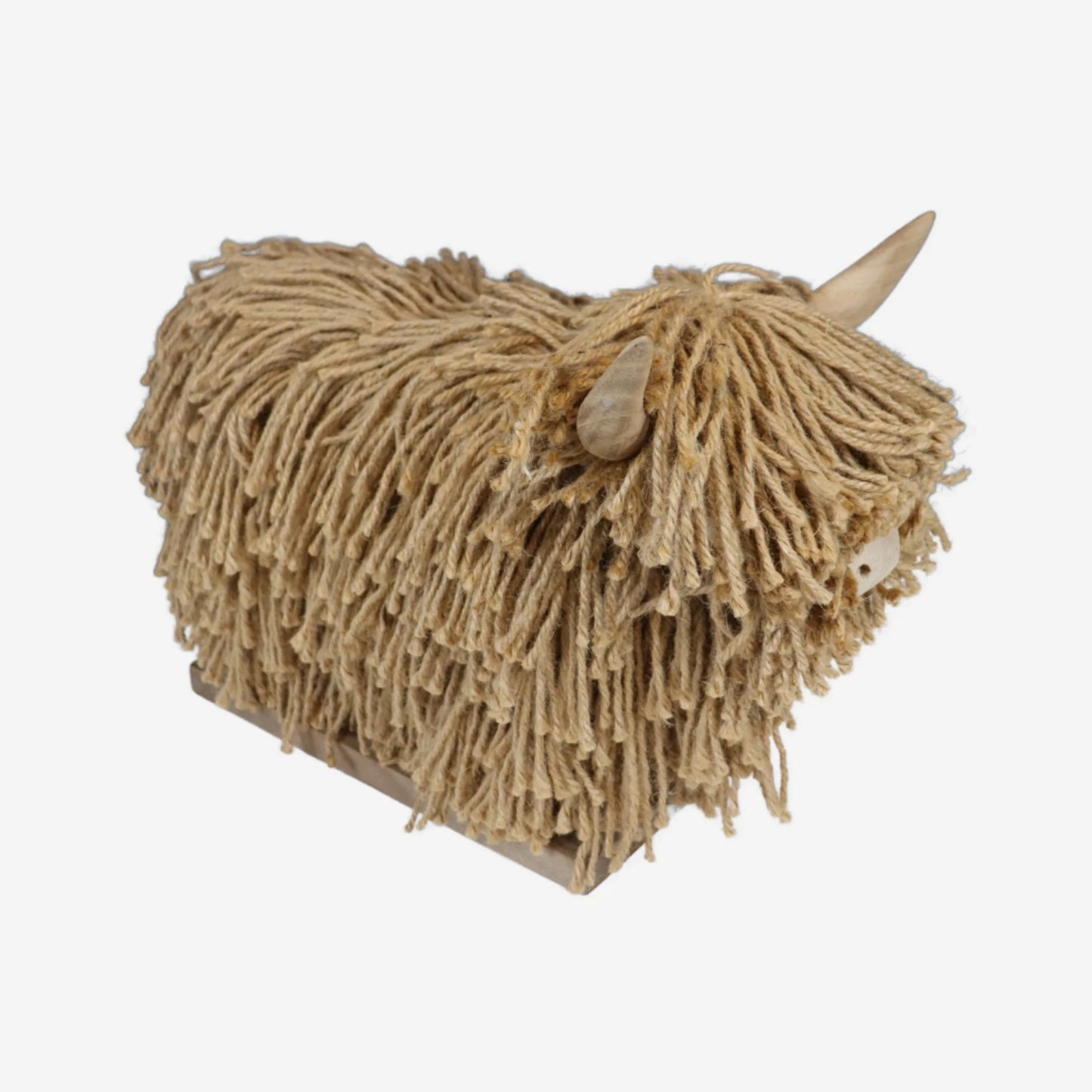 Textured jute sculpture of a highland cow on a white background