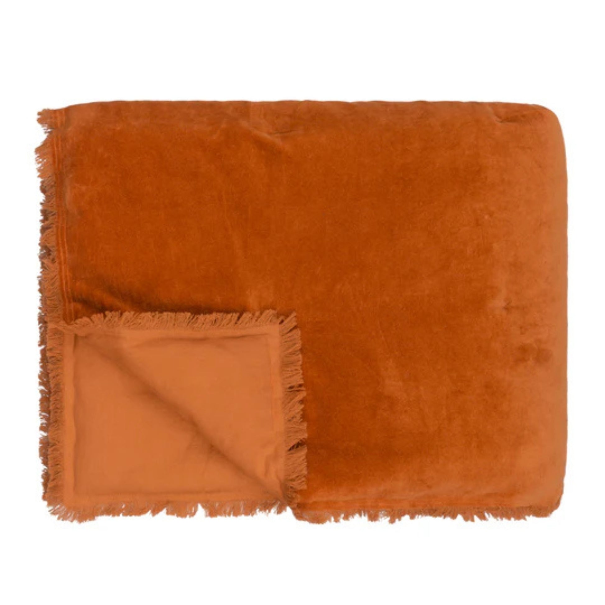 Folded orange throw on a white background