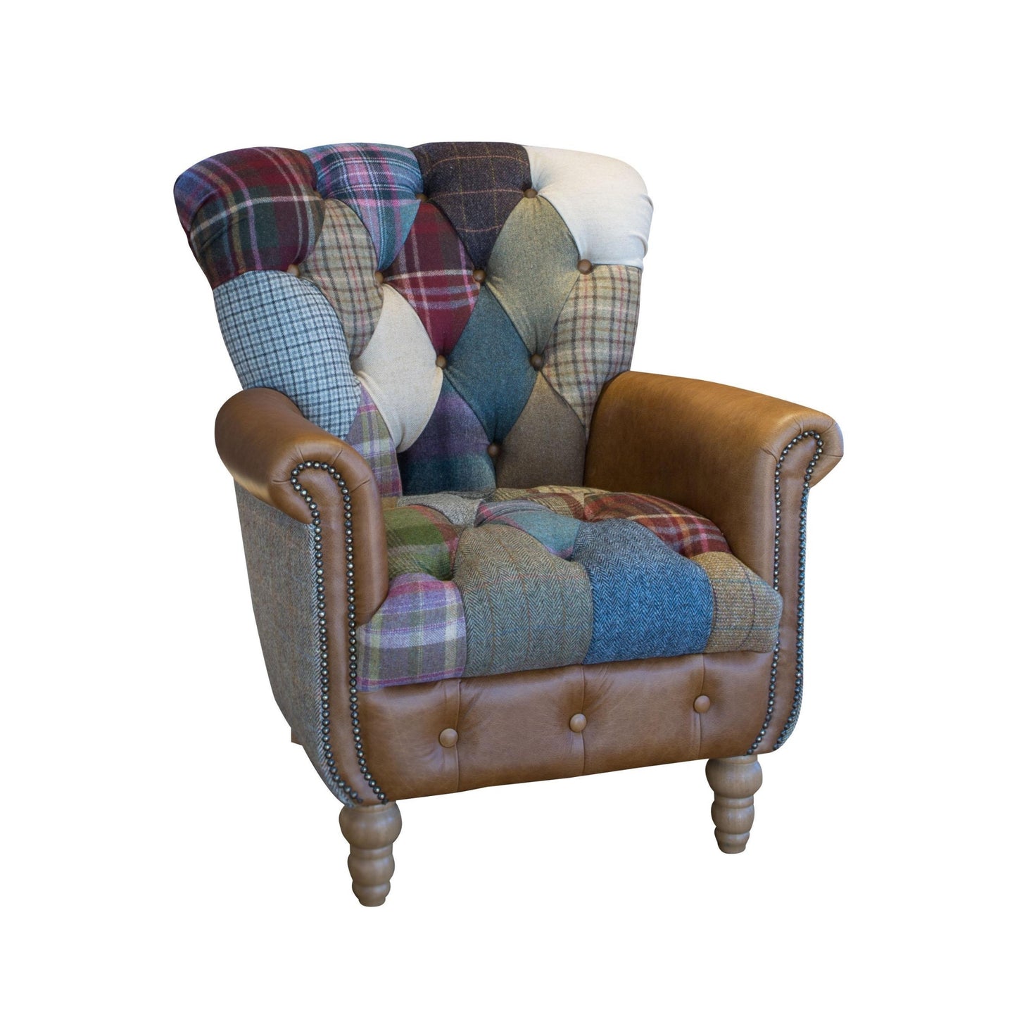 Multicolored patchwork armchair with brown leather accents on a white background