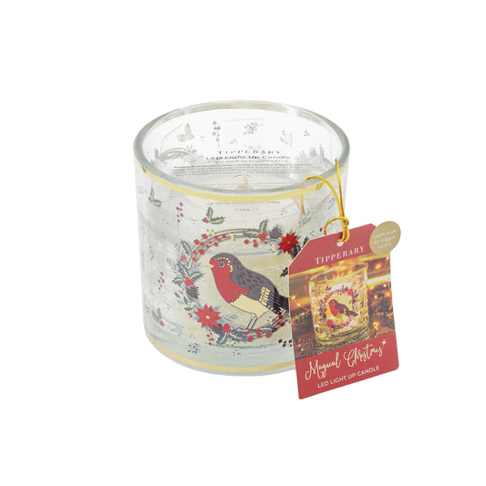 Christmas theme candle with a robin design and a Merry Christmas gift tag