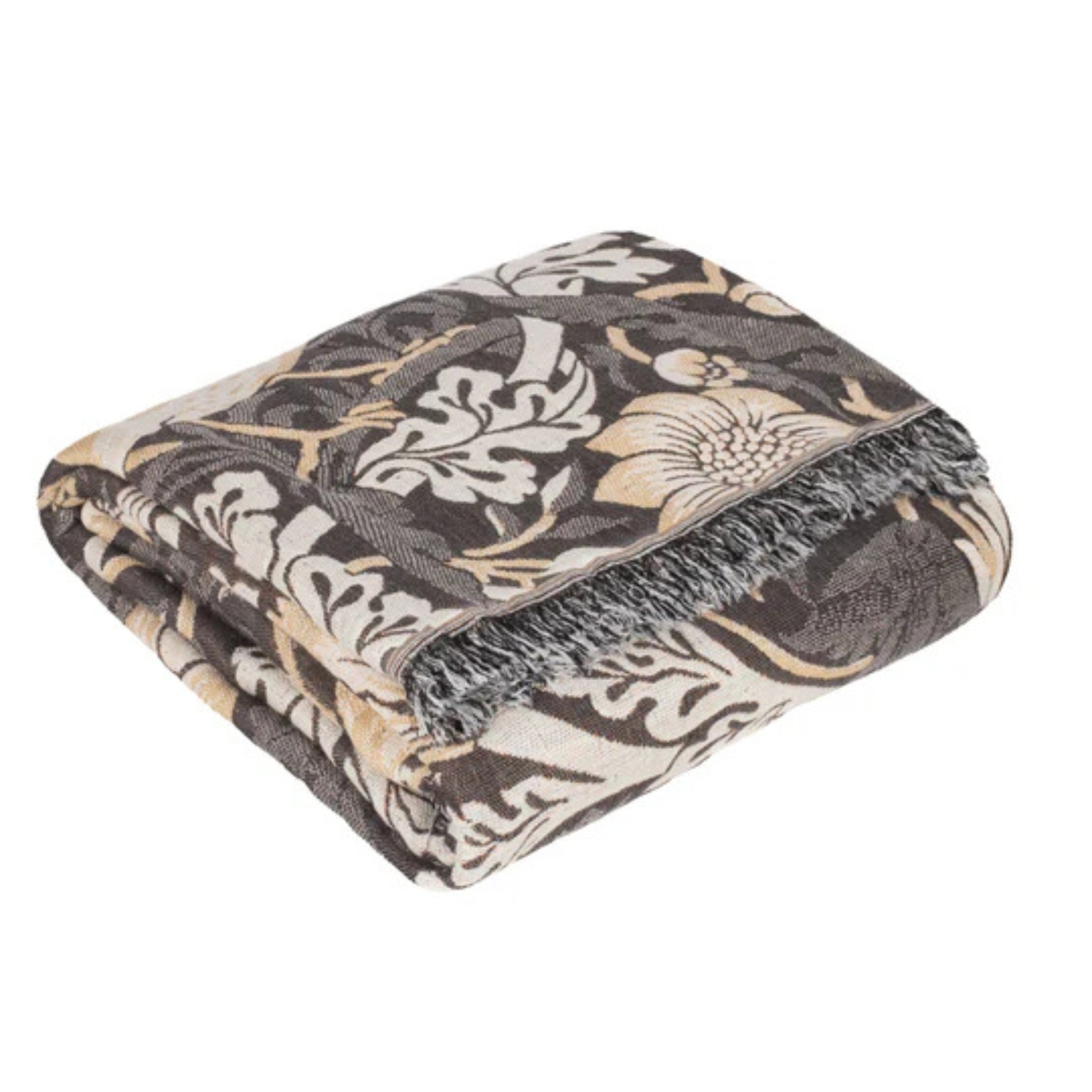 Patterned throw folded on a white background