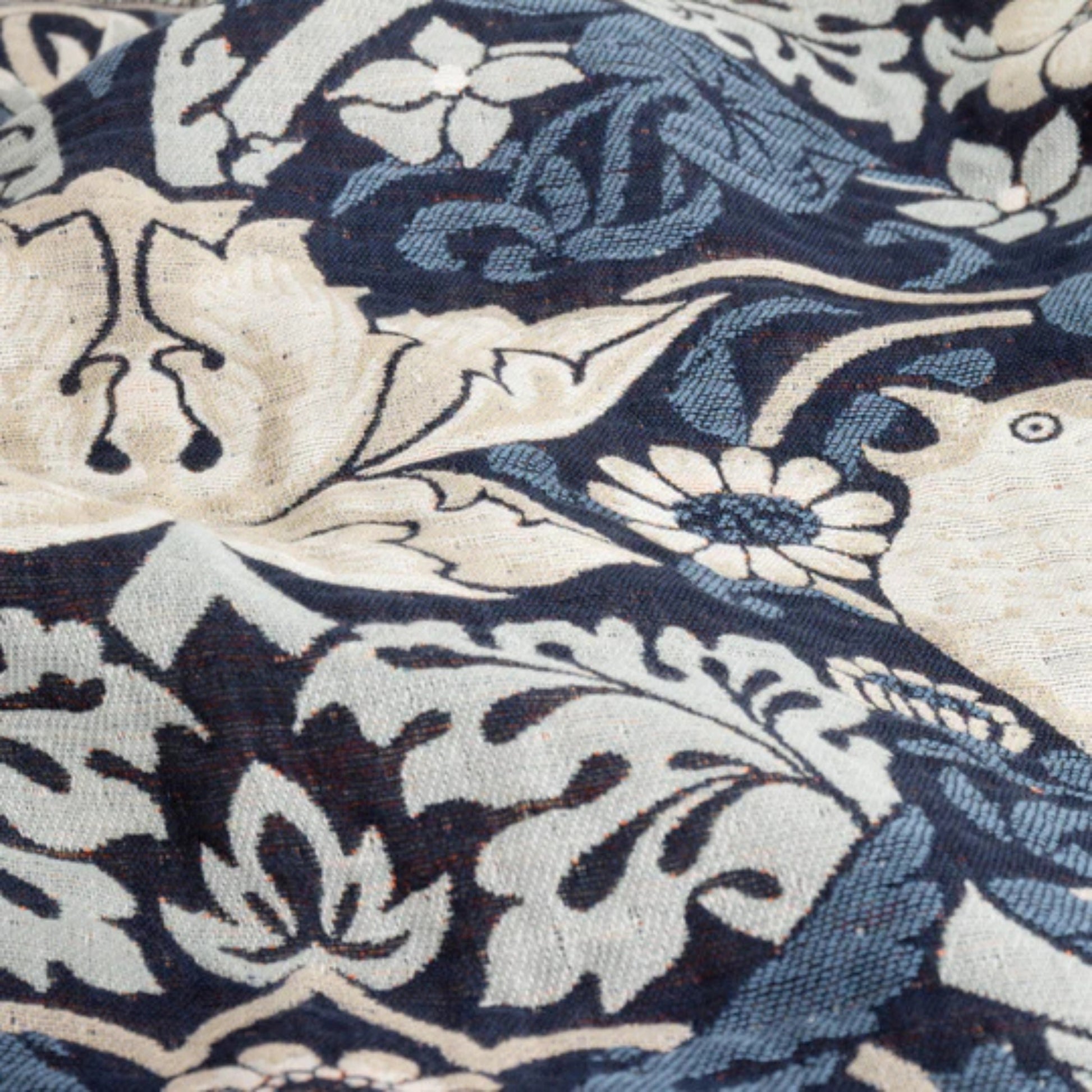 Close-up of a blue and beige floral patterned fabric