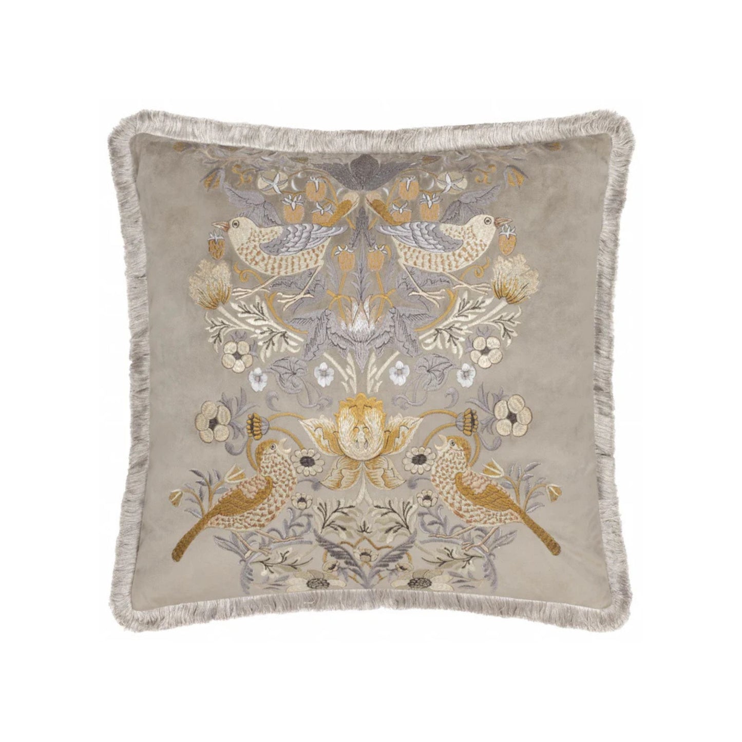 A square-shaped, biscuit coloured velvet cushion with a floral and animal embroidery pattern, featuring birds and surrounding floral designs, finished with an accent fringed edging on a white background,