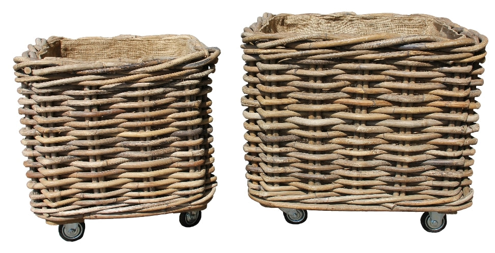 Two Handmade rattan log baskets on wheels  on a white background
