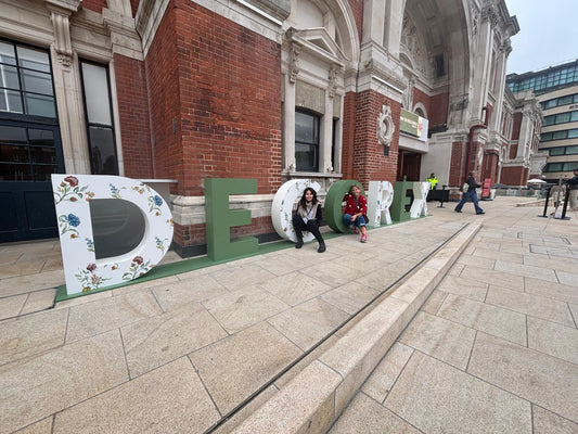 The Ebony Rose team at the giant floral DECOREX letters outside Olympia London