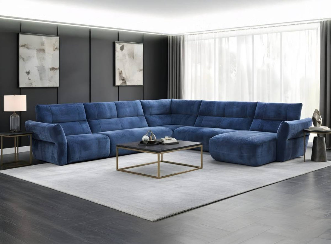 The Jazz Collection sectional sofa in ocean blue chenille, styled in a contemporary living room with dark walls and brass coffee table