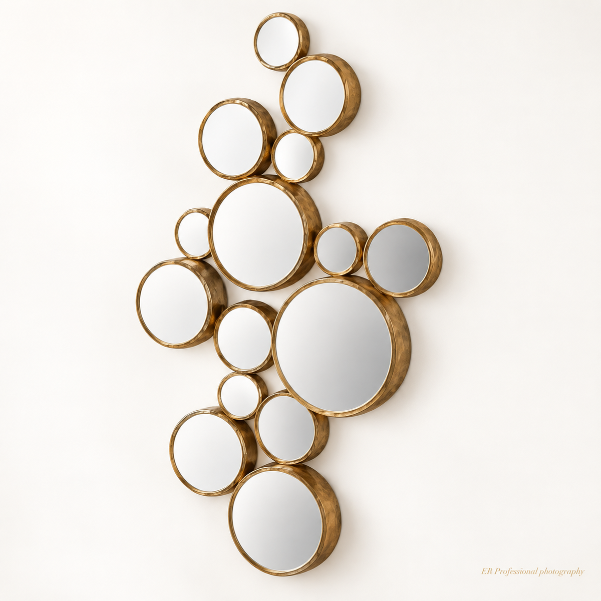 An abstract cluster wall mirror featuring multiple organic circular shapes with textured gold frames on a clean white background.