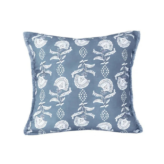 Decorative pillow with floral pattern on a blue background