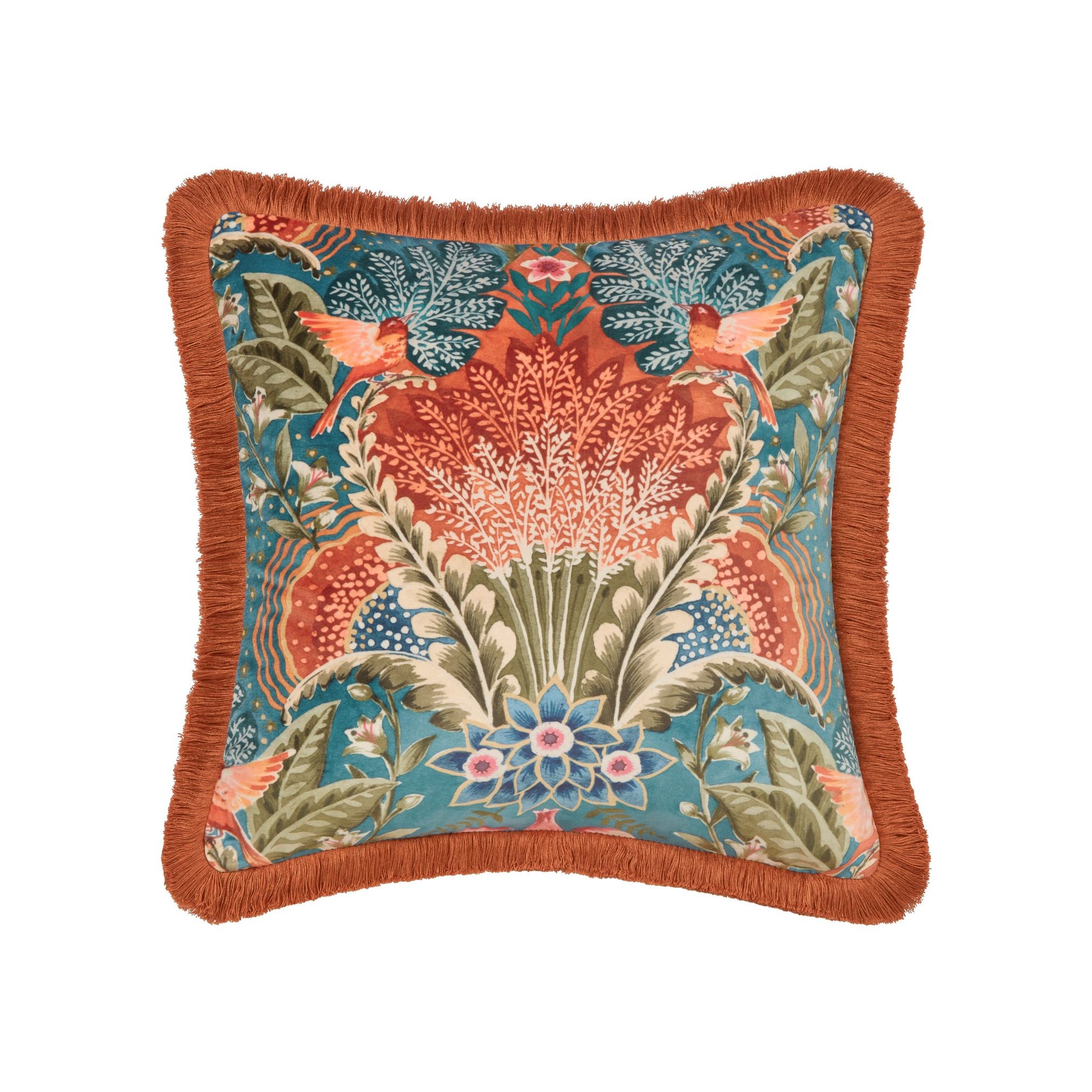 A square-shaped Babooshka cushion with a teal background and a floral pattern featuring birds. It has a burnt orange fringe around the border.