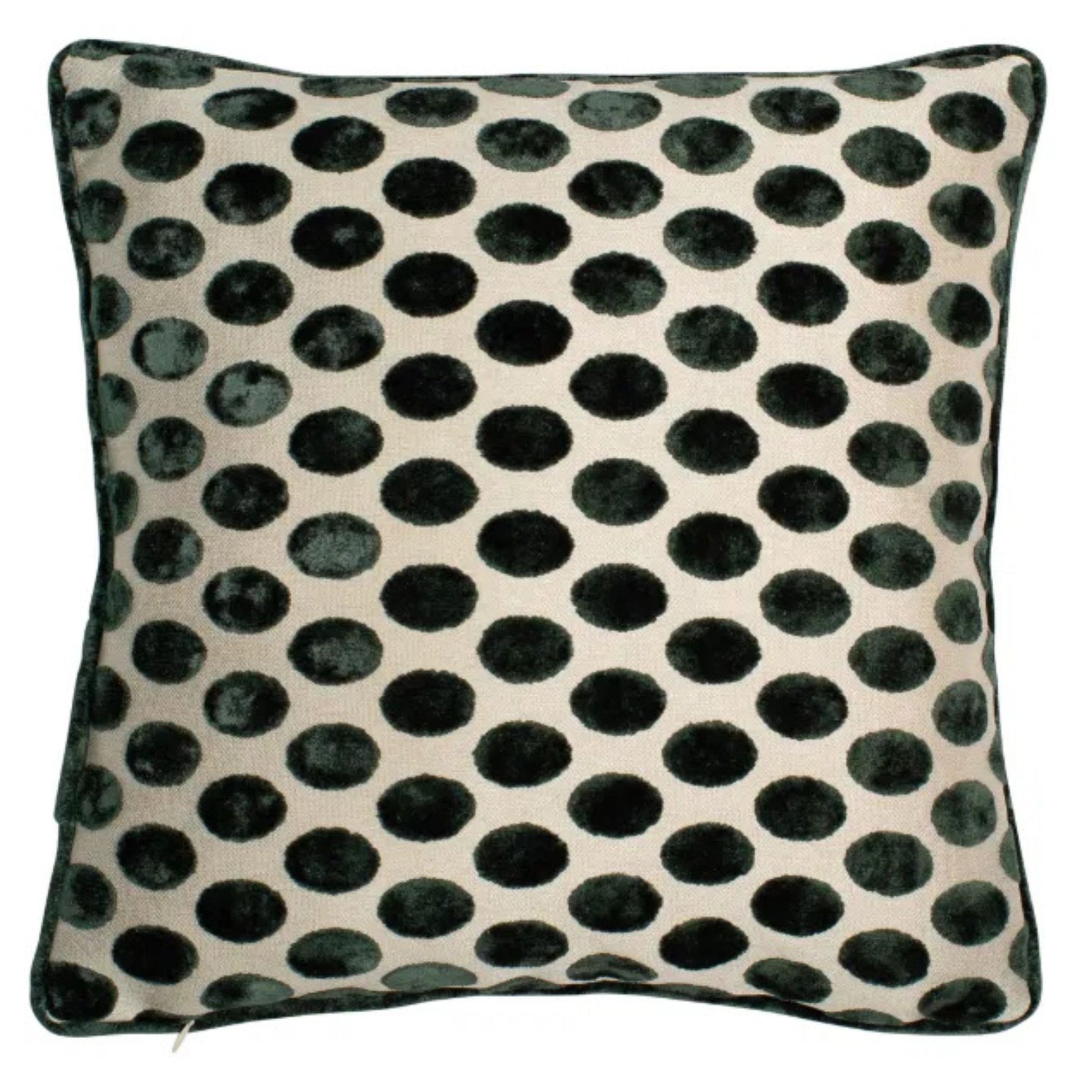 A square-shaped cushion with a deep green velvet polka dot pattern on a natural beige background, accented with green piping.