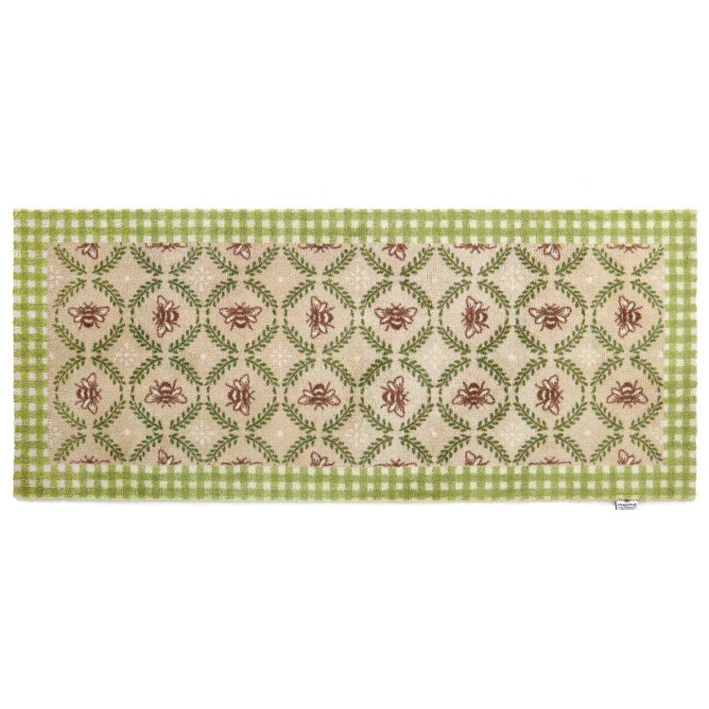 Decorative table runner with green and red pattern on a white background
