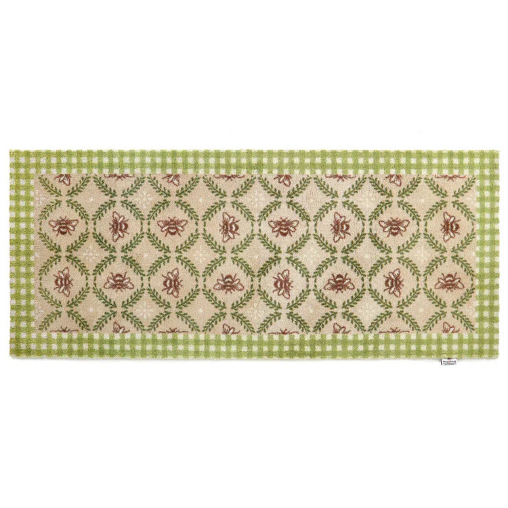 Decorative table runner with green and red pattern on a white background