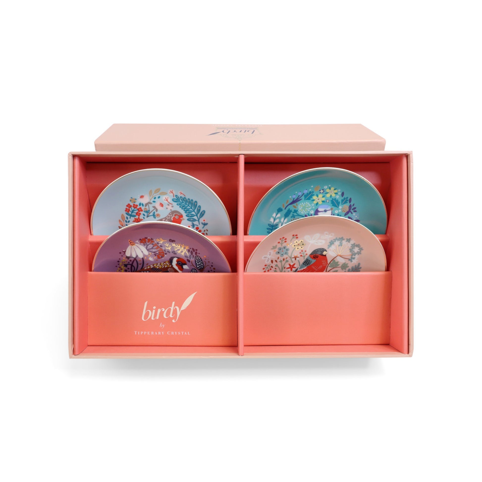 Set of four decorative plates in a pink box with 'birdy' branding.