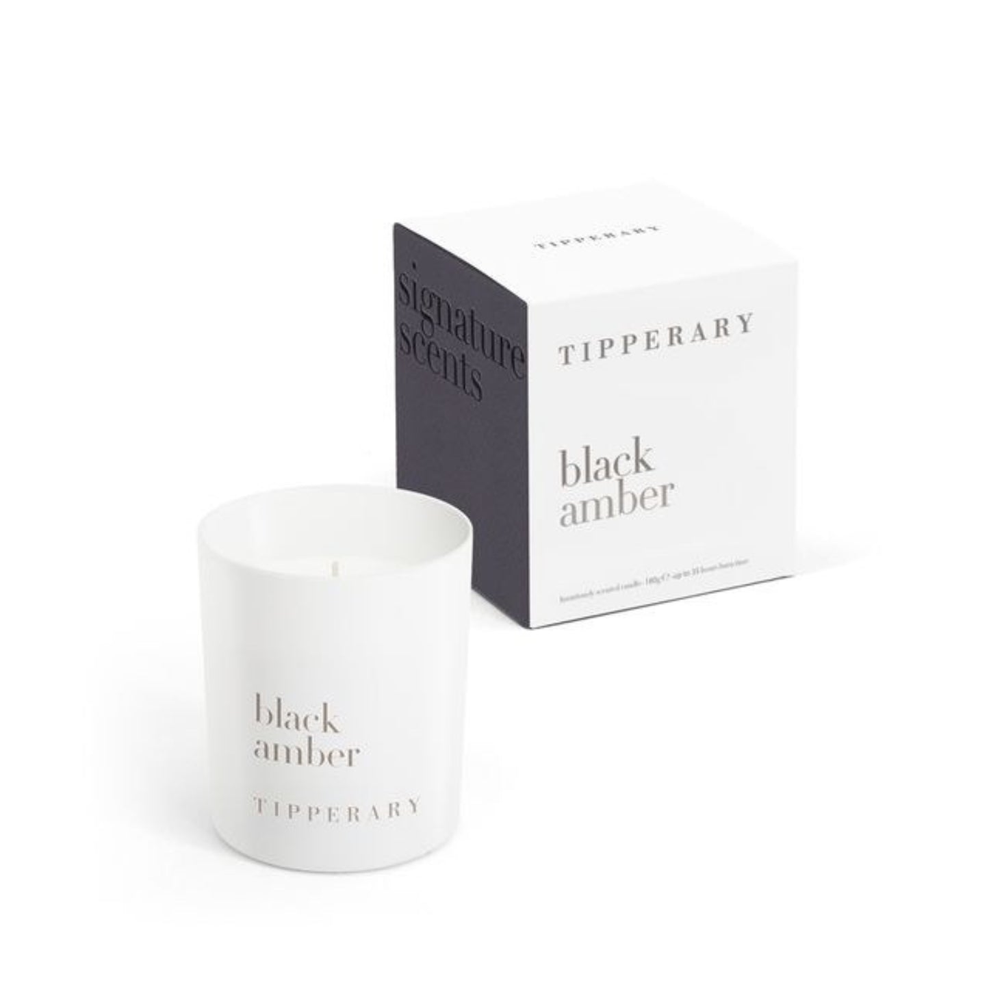 White candle labeled 'Black Amber' by Tipperary with packaging on a white background