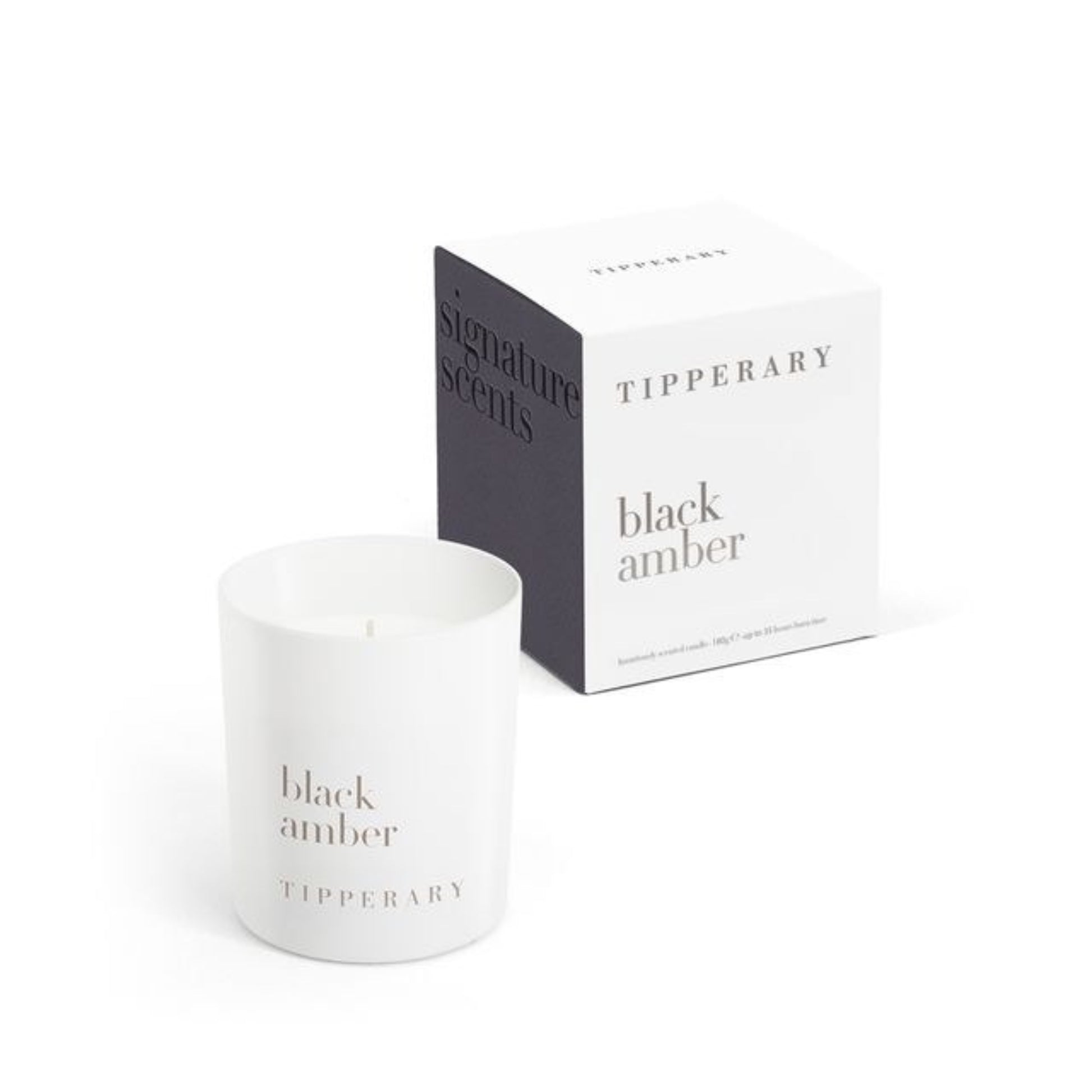 White candle labeled 'Black Amber' by Tipperary with packaging on a white background
