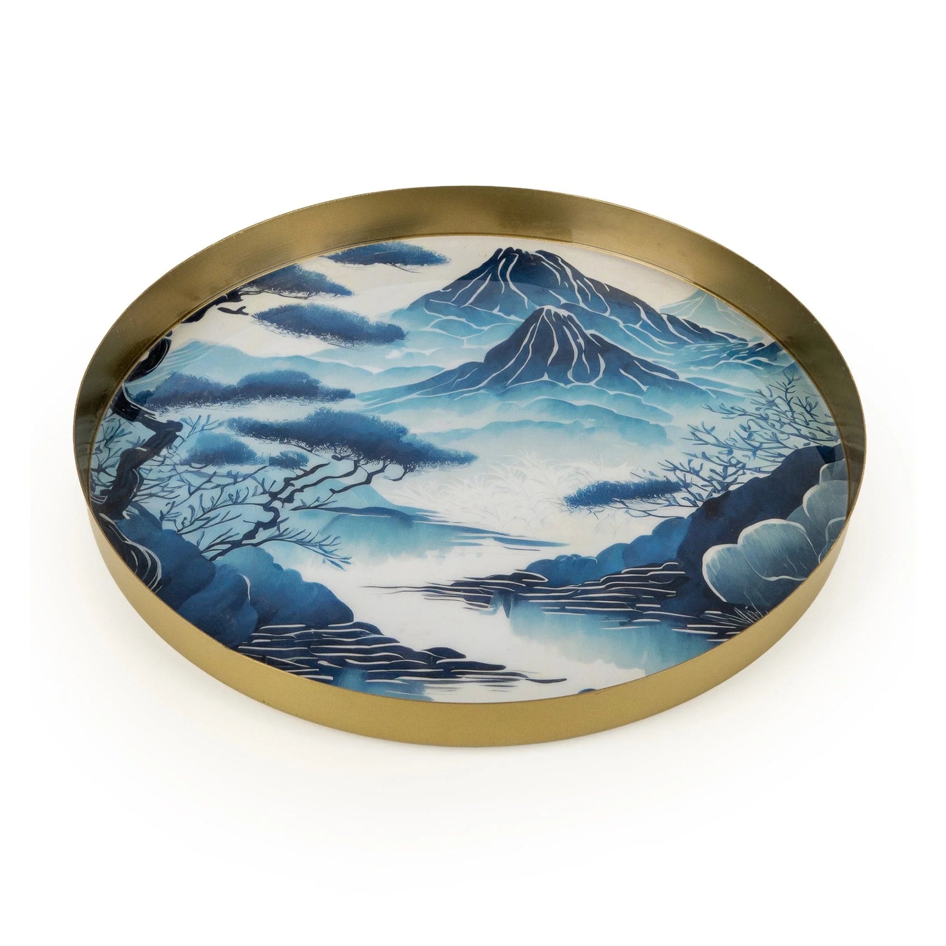 Round tray with a gold rim and mountain landscape design on a white background