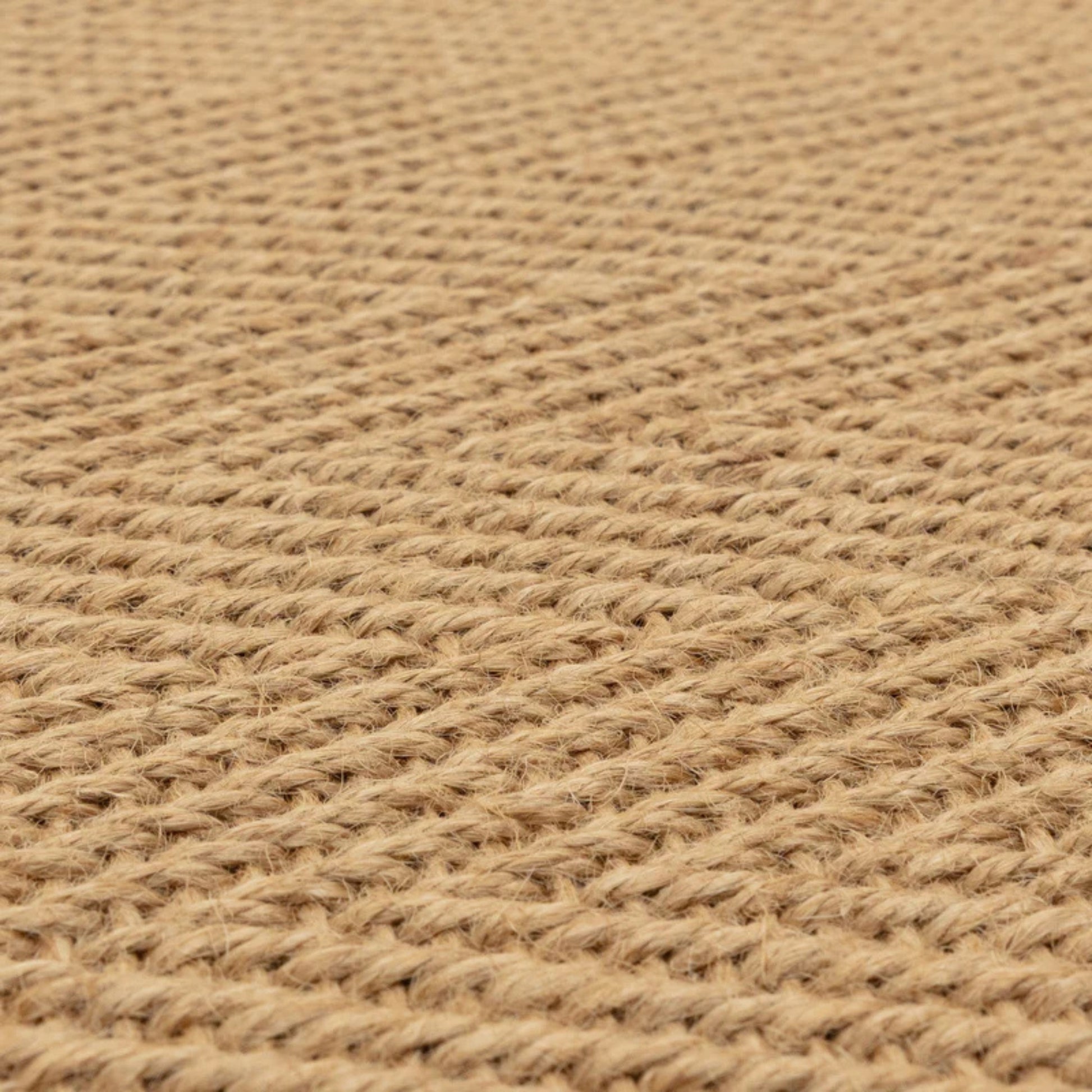 Close-up of a textured beige fabric surface