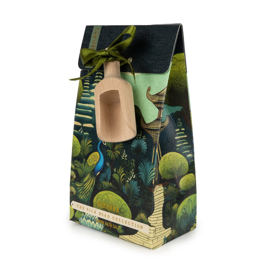 Gift set with a bottle and scoop in a decorative box with a jungle theme on a white background