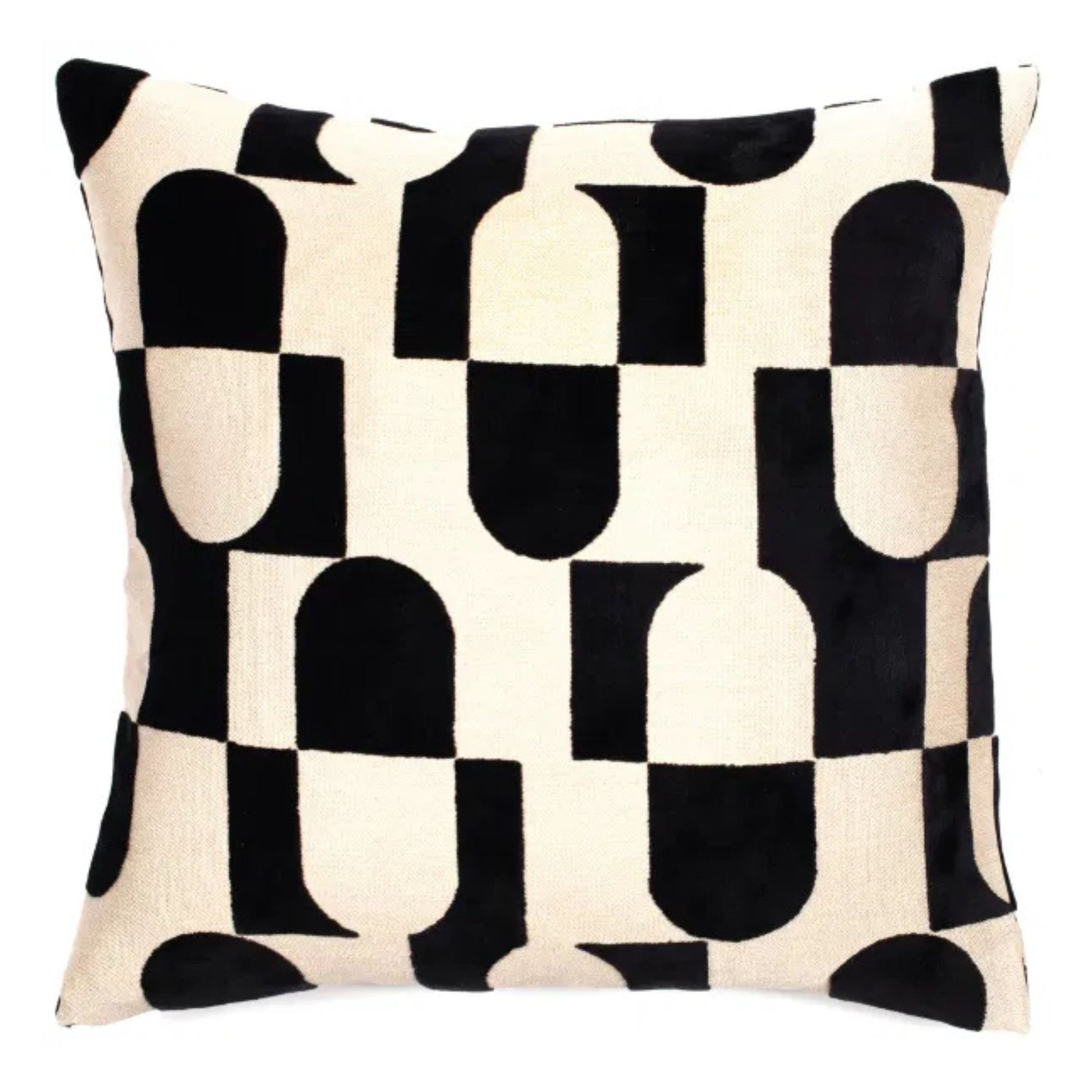 A black and white geometric pattern cushion