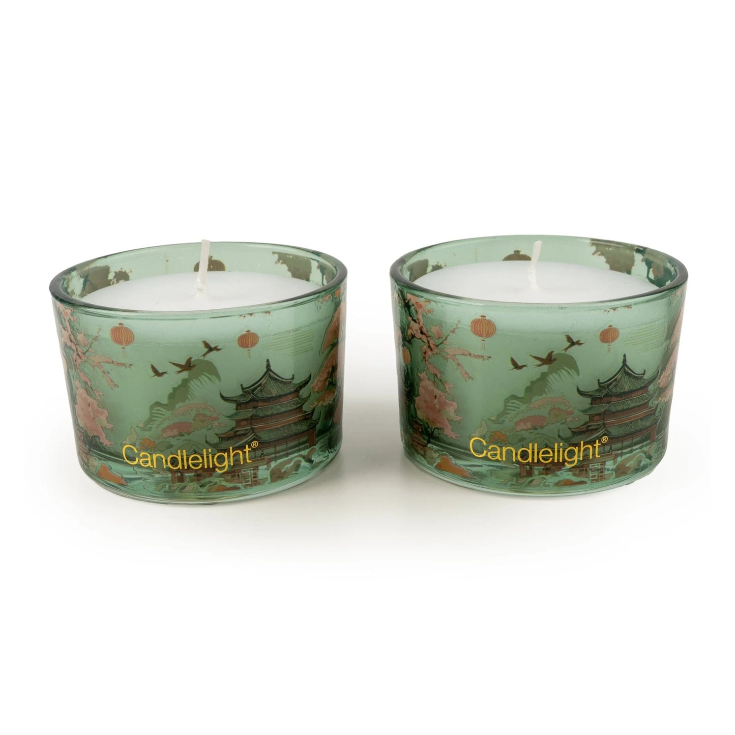 Two green candles with decorative designs and 'Candlelight' branding on a white background