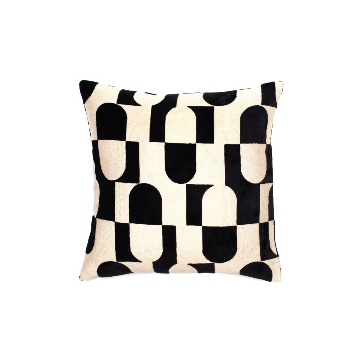 A black and white geometric pattern cushion