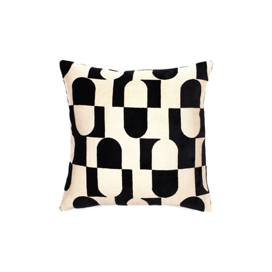 A black and white geometric pattern cushion
