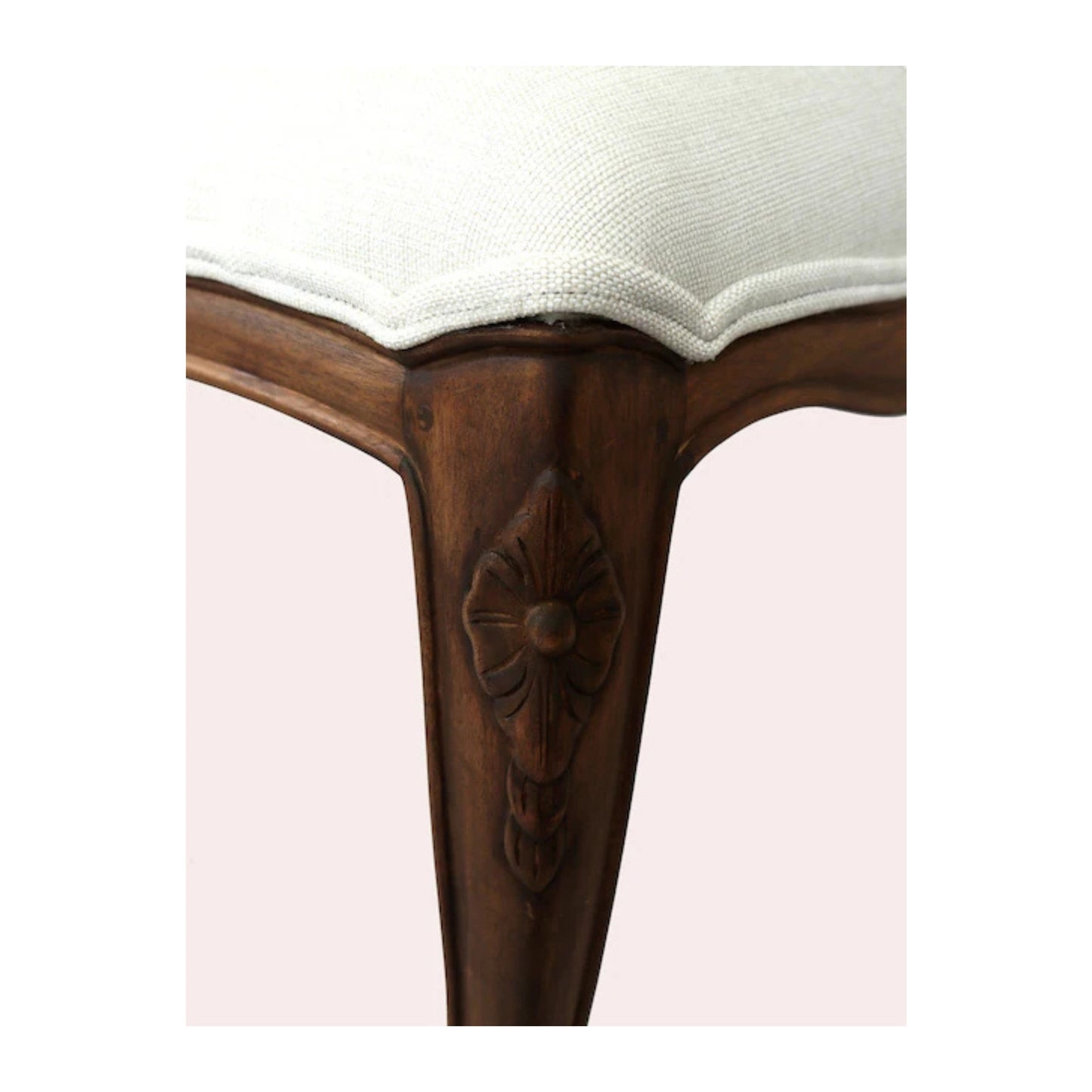 Upholstered bench showcasing a solid wood frame in an aged walnut finish and a beige upholstered top.