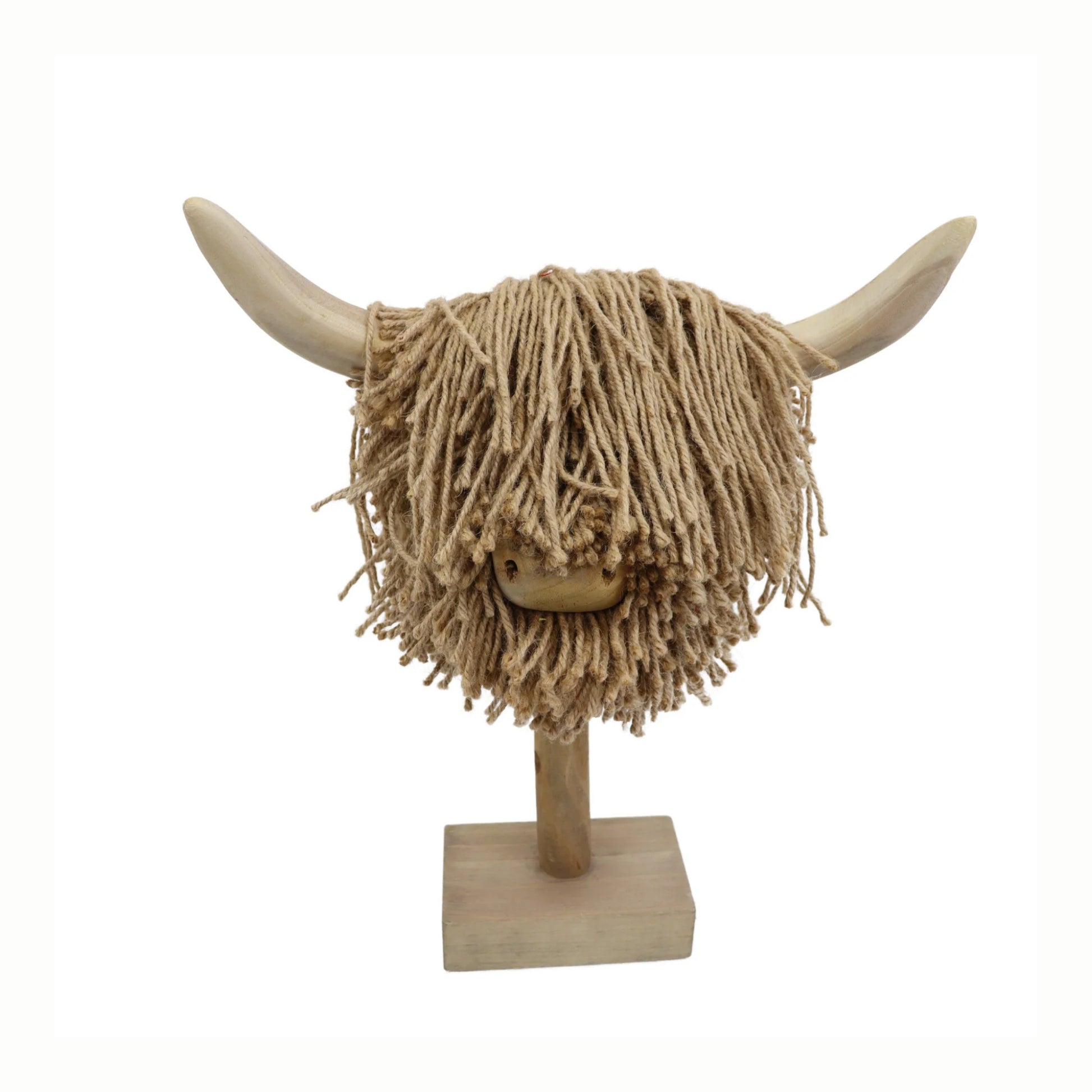 Decorative head of a highland cow with long jute hair on a stand against a white background