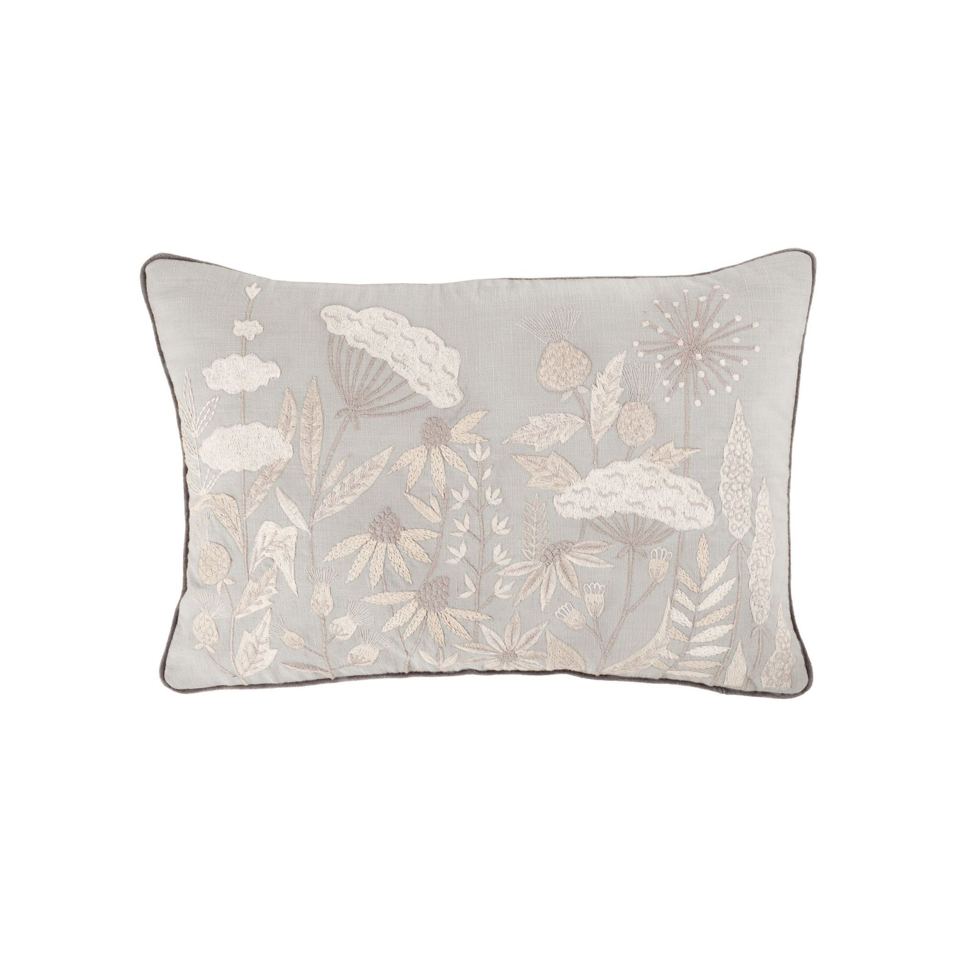 A rectangular Ezra Cloud cushion with a floral embroidered design in beige on a grey background, piped in deep grey velvet.