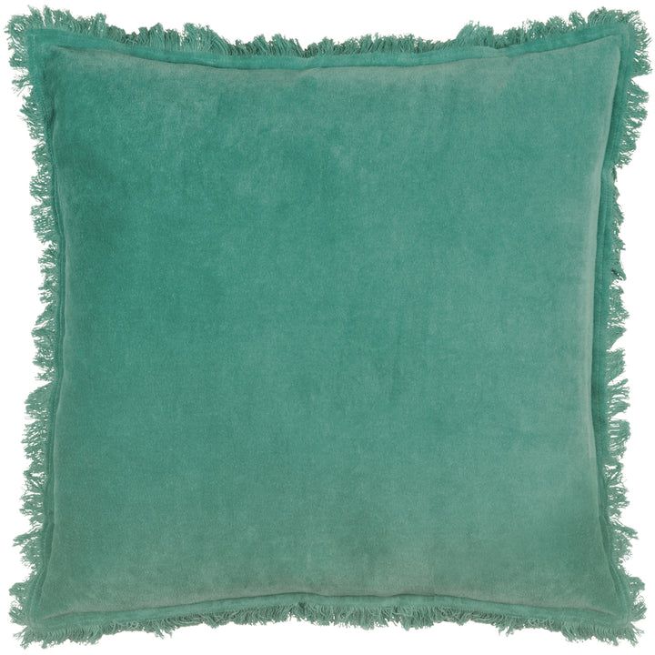 A teal green velvet cushion with fringed edges