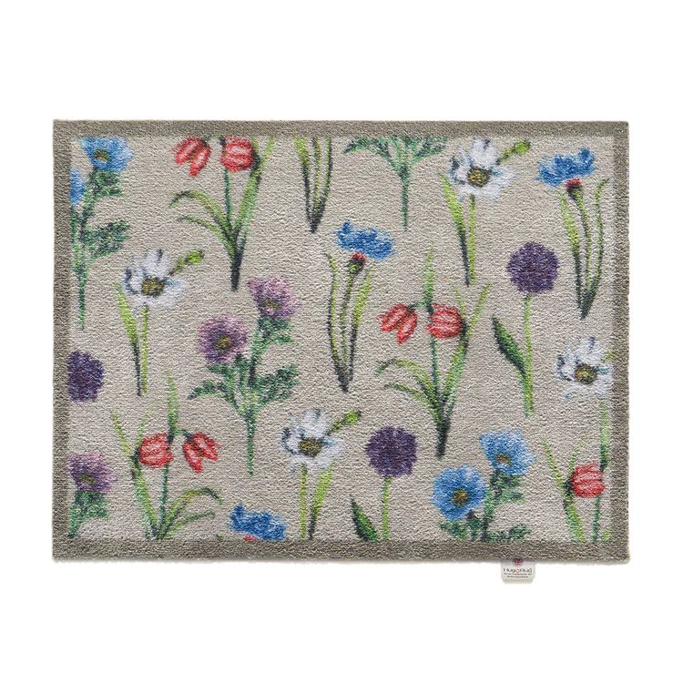 Hug Rug doormat with a colourful floral design 