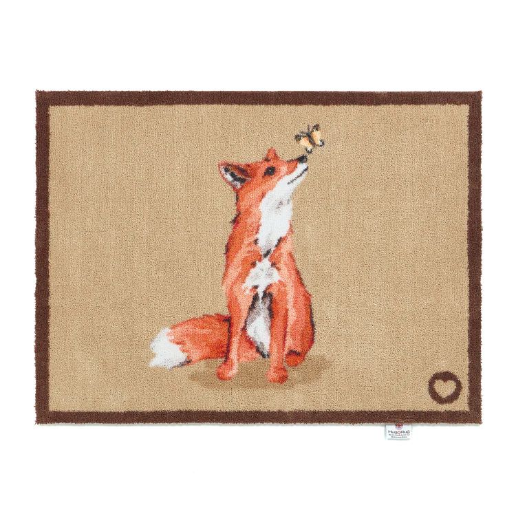 Hug Rug Door mat with a sitting ginger fox and butterfly balancing on his nose. 