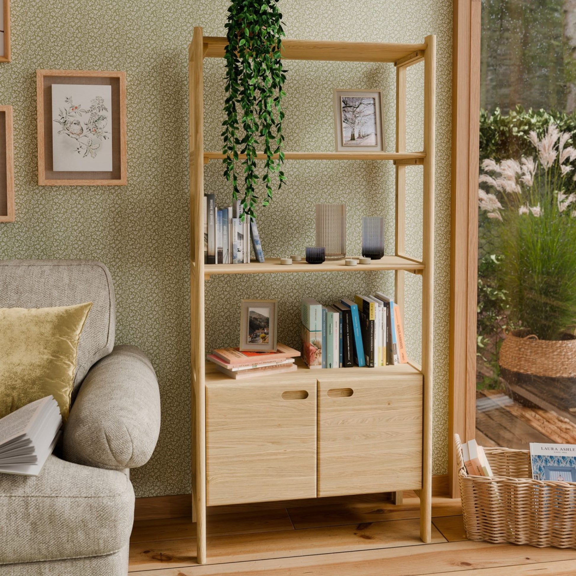 Wooden bookshelf with books and decor items in a living room setting.