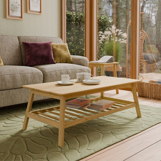 Living room with a wooden coffee table, sofa, and decorative pillows.