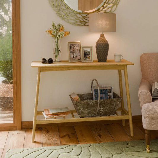 Wooden console table with decorative items in a living room setting