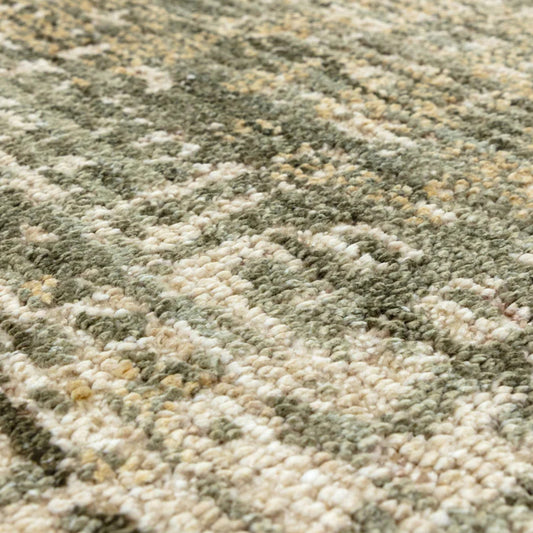 Close-up of a textured green and beige carpet