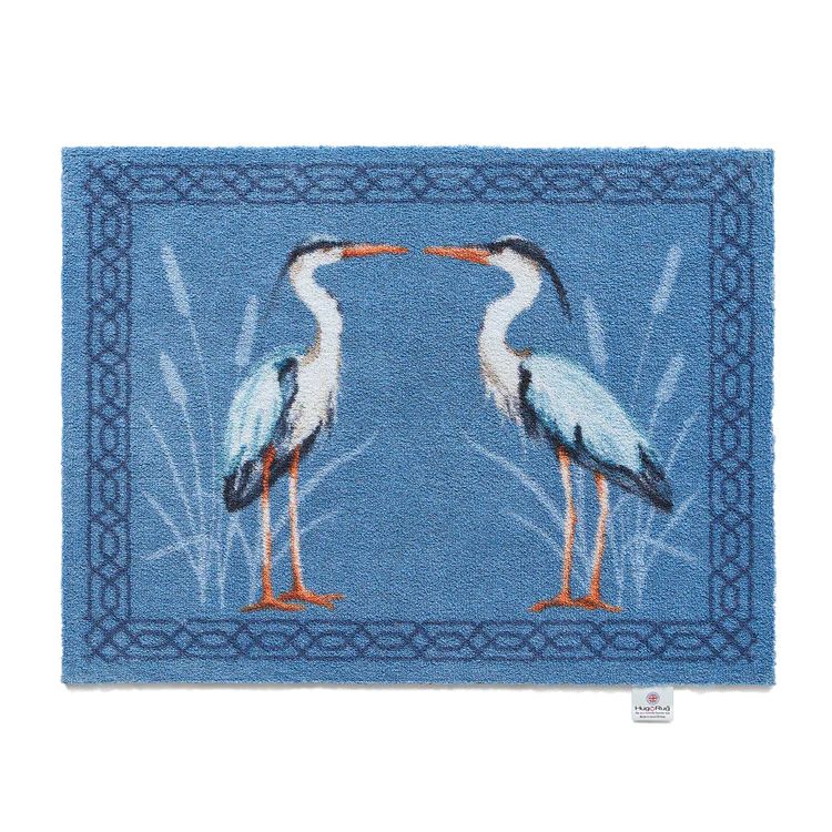Hug Rug Washable Door Mat with 2 Herons facing each other on a blue background