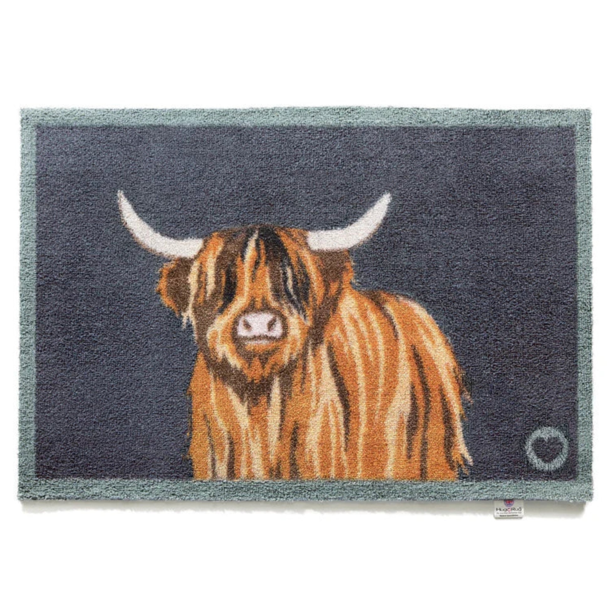 Doormat with a highland cow design on a dark blue background