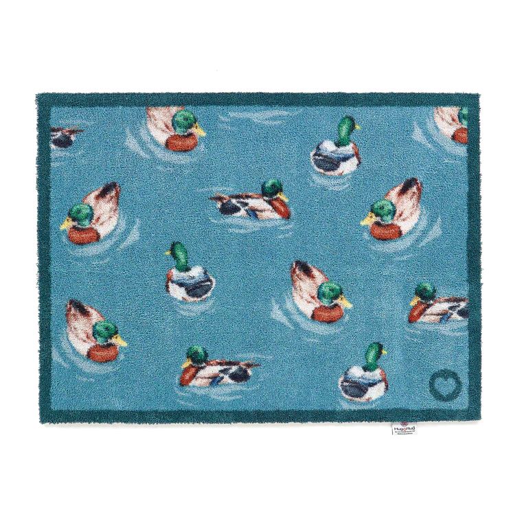 Hug rug washable mat with swimming ducks design on a blue background